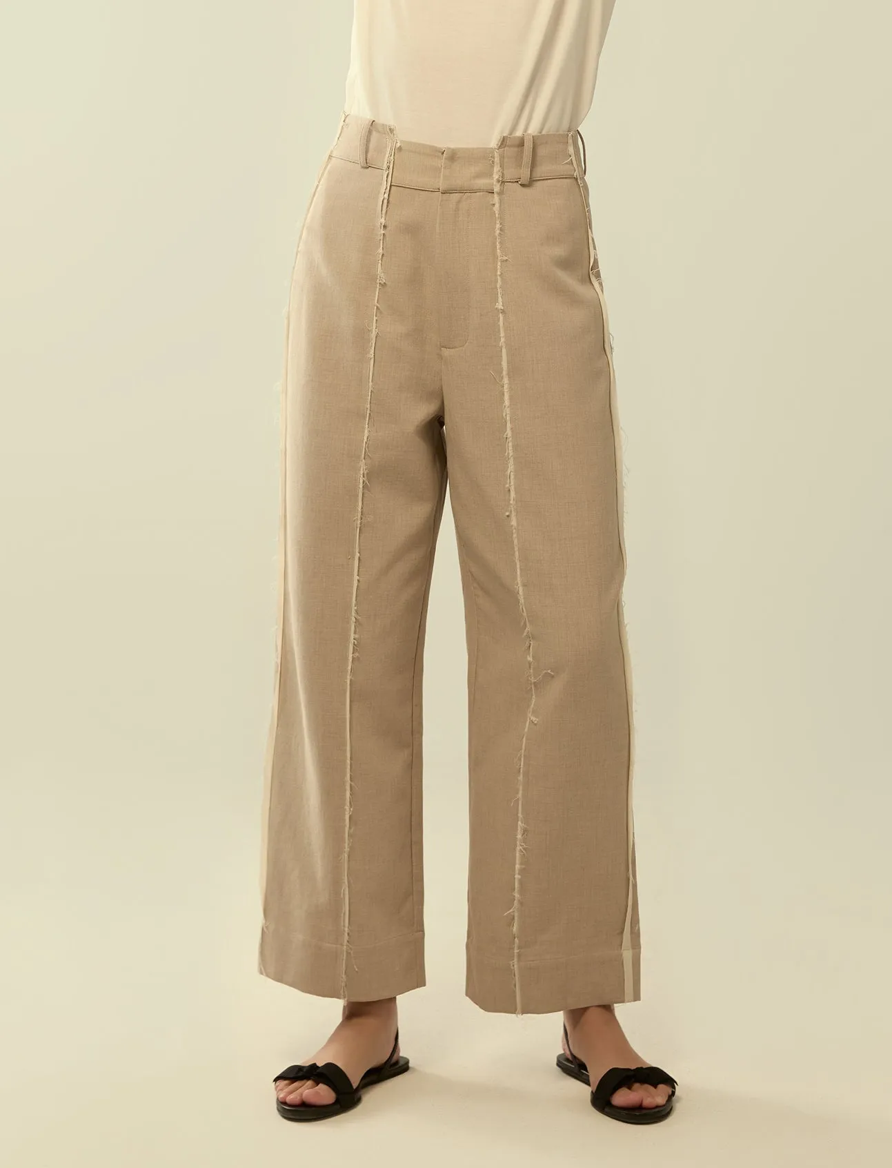 deconstructed exposed seam trousers