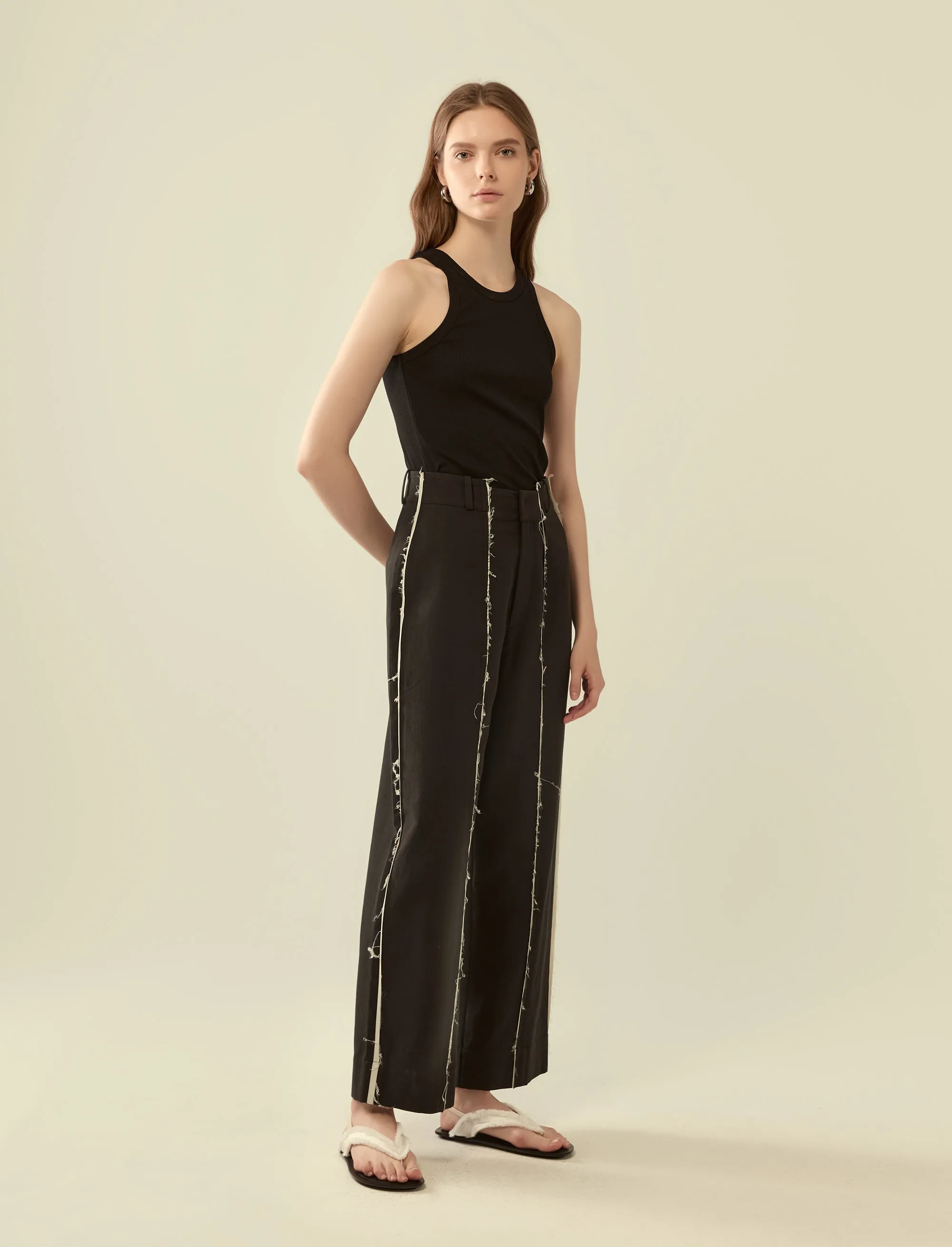 deconstructed exposed seam trousers