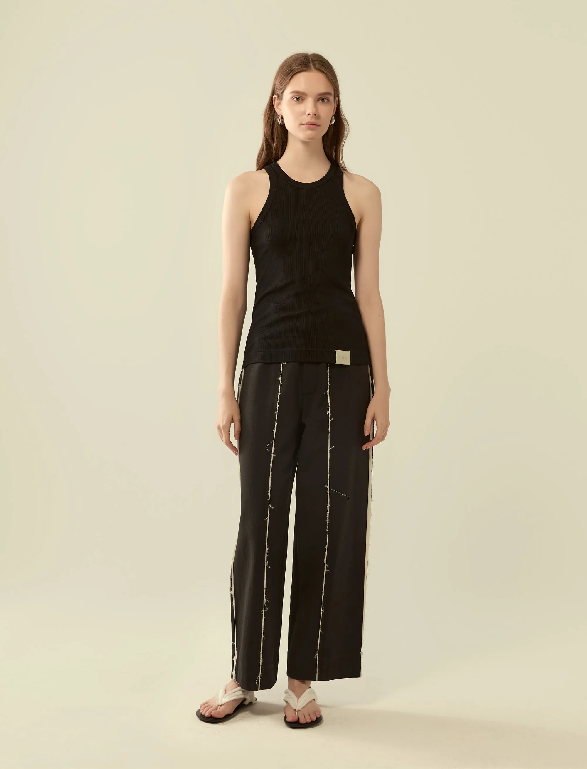 deconstructed exposed seam trousers