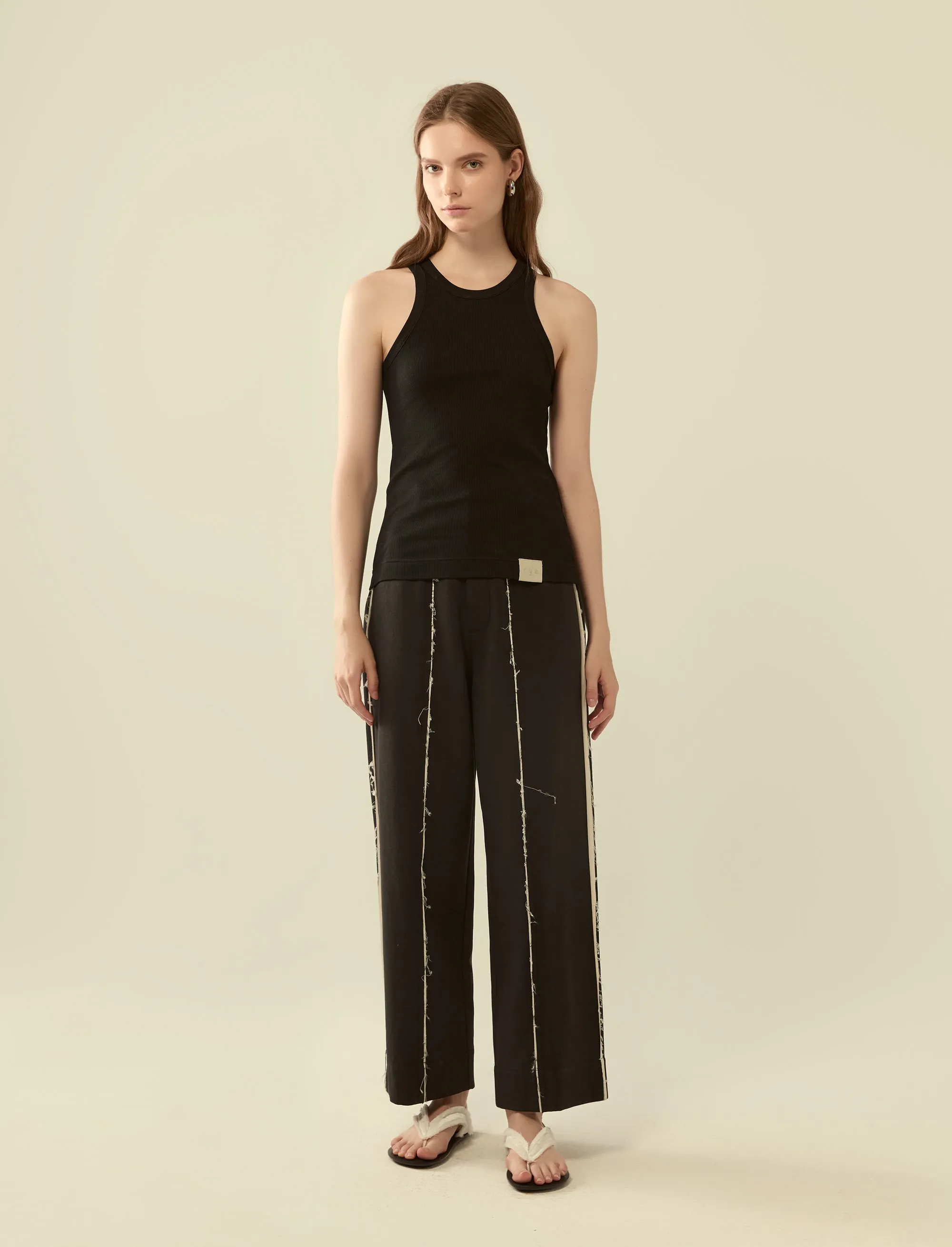 deconstructed exposed seam trousers